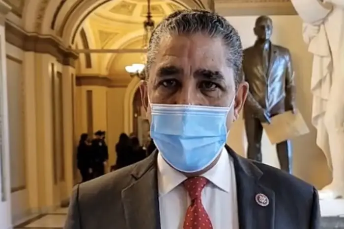 Congressman Adriano Espaillat stands inside the U.S. Capitol ready to vote on impeaching President Donald Trump.